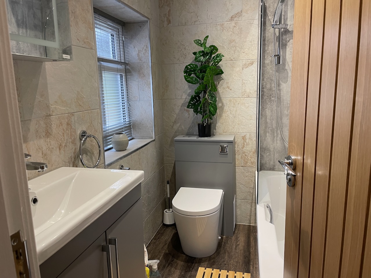 Downstairs family bathroom with shower over bath